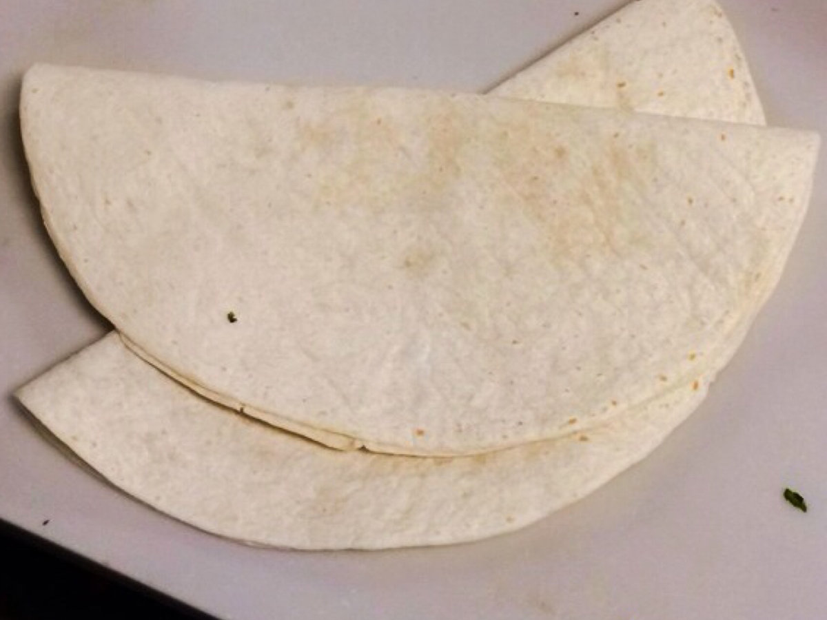 Hand-pressed flour tortillas off the comal